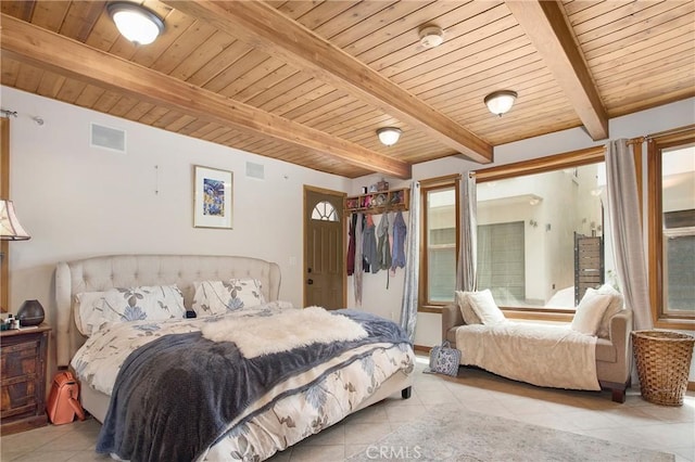 bedroom featuring beamed ceiling, light tile patterned flooring, and wooden ceiling