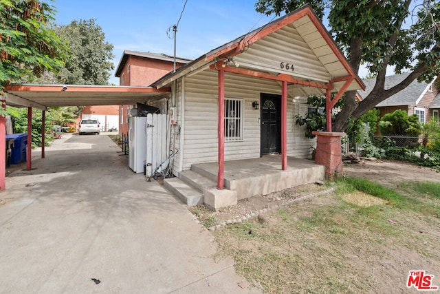 bungalow-style home featuring a carport