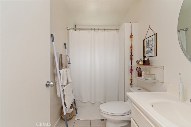 bathroom with walk in shower, vanity, toilet, and tile patterned floors