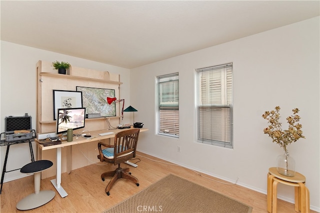 home office with wood-type flooring