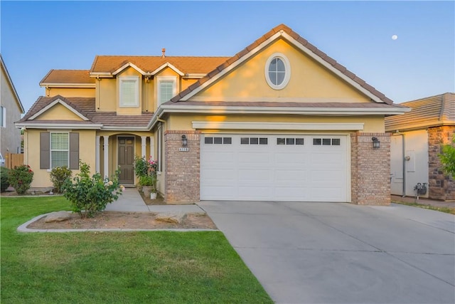 view of front of home with a garage and a front yard