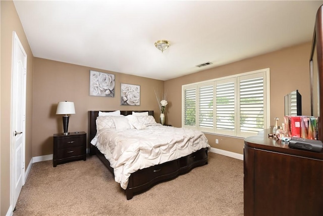 bedroom featuring light carpet