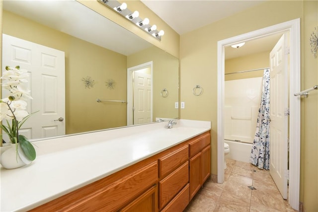 full bathroom with tile patterned flooring, vanity, toilet, and shower / bath combo with shower curtain