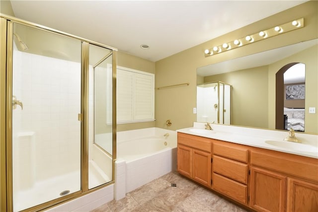 bathroom featuring vanity, tile patterned flooring, and plus walk in shower