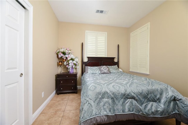 bedroom featuring light tile patterned floors