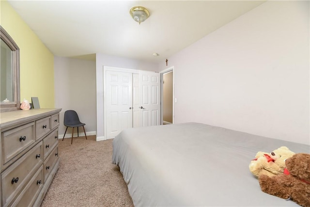 carpeted bedroom with a closet