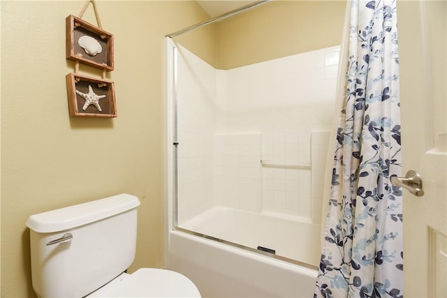 bathroom with shower / tub combo and toilet