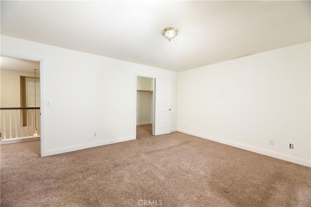 spare room featuring carpet flooring