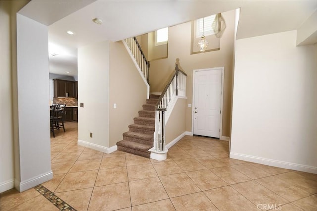 entryway featuring light tile patterned floors