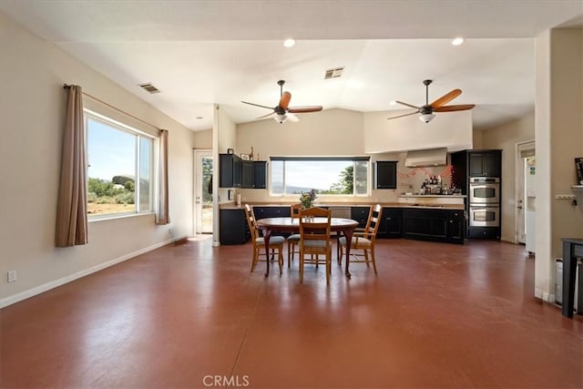 dining space with concrete floors, visible vents, and a healthy amount of sunlight