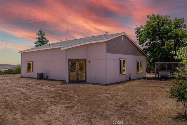 back house at dusk with cooling unit