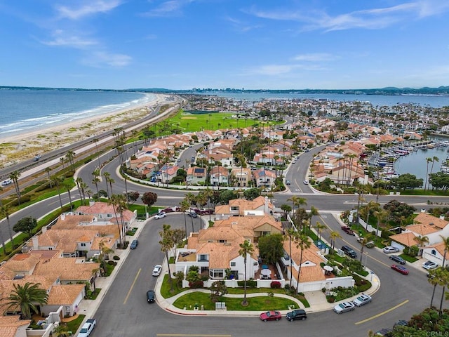 bird's eye view featuring a water view and a view of the beach