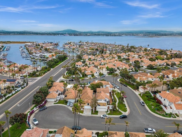 birds eye view of property featuring a water and mountain view