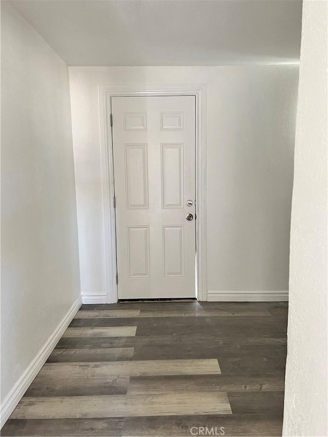 empty room featuring dark hardwood / wood-style flooring