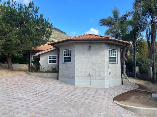 view of property exterior with a patio