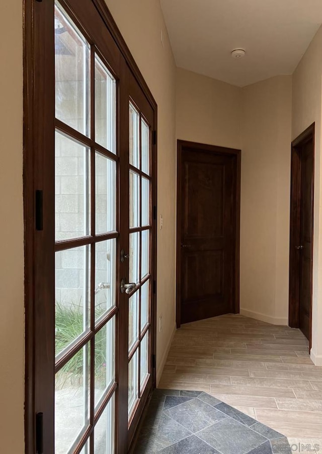 corridor featuring light hardwood / wood-style floors