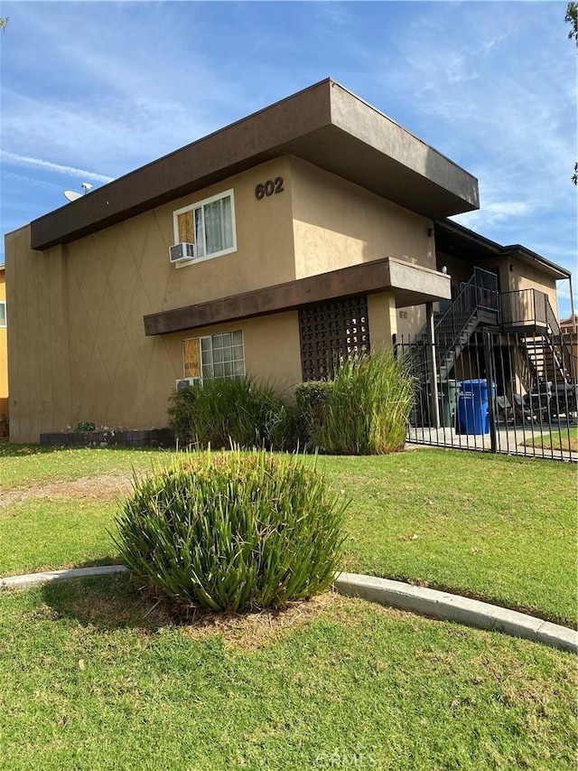 view of property exterior featuring a yard