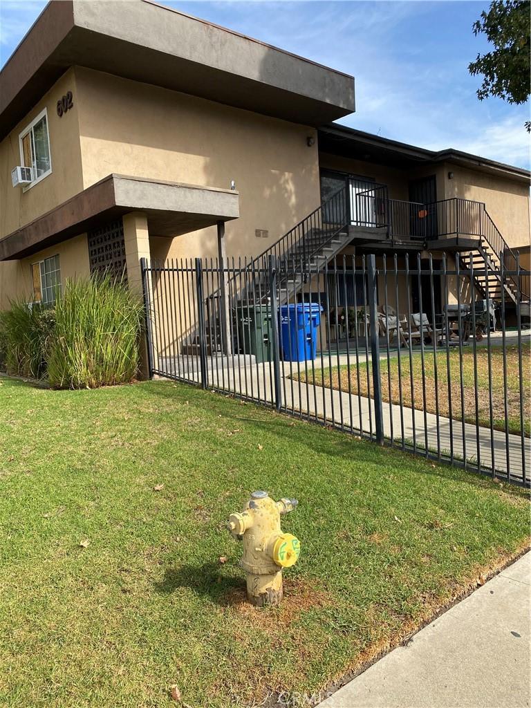 602 Karesh Ave, Pomona, CA 91767 - view of side of home with stairs and stucco siding