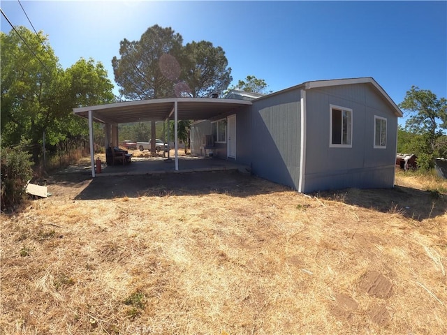 view of home's exterior with a carport