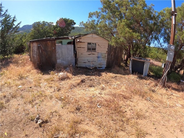 view of outbuilding with a mountain view