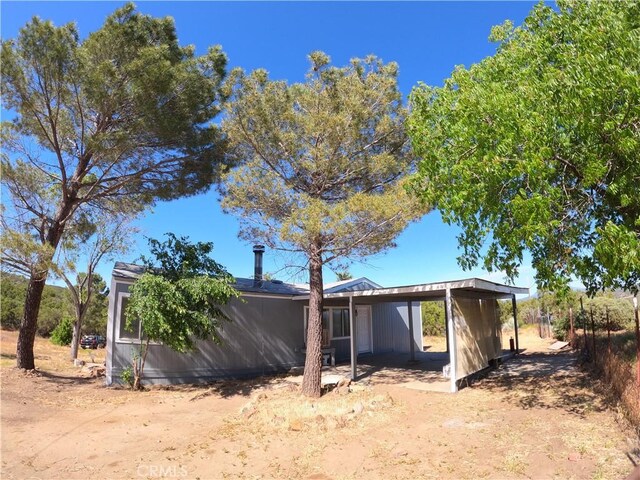 exterior space featuring a carport