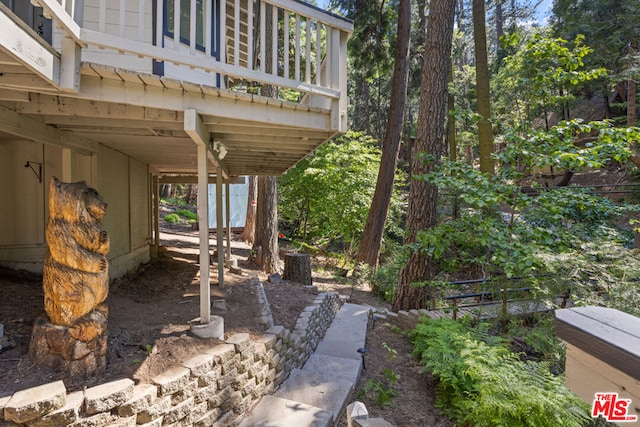 view of patio featuring a balcony