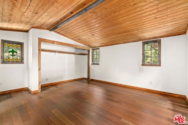 spare room with a healthy amount of sunlight, wood ceiling, and dark hardwood / wood-style flooring