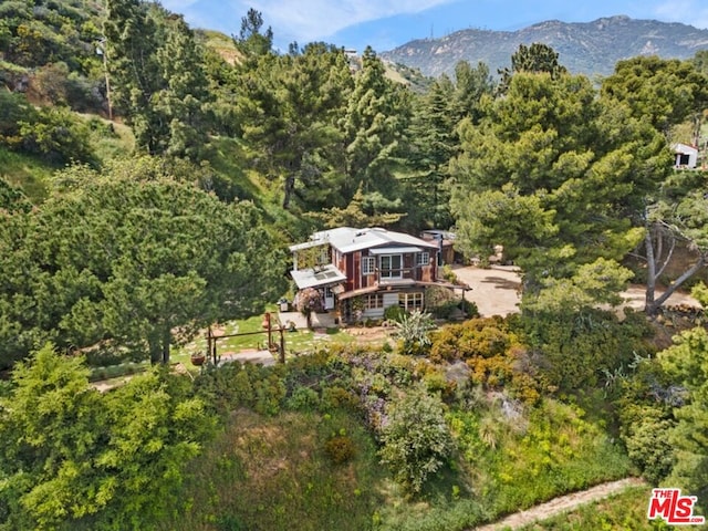 birds eye view of property featuring a mountain view