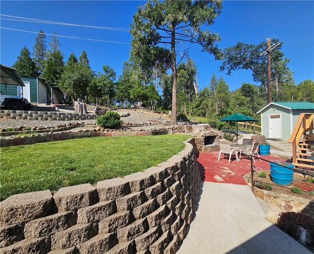 view of patio / terrace with a storage shed