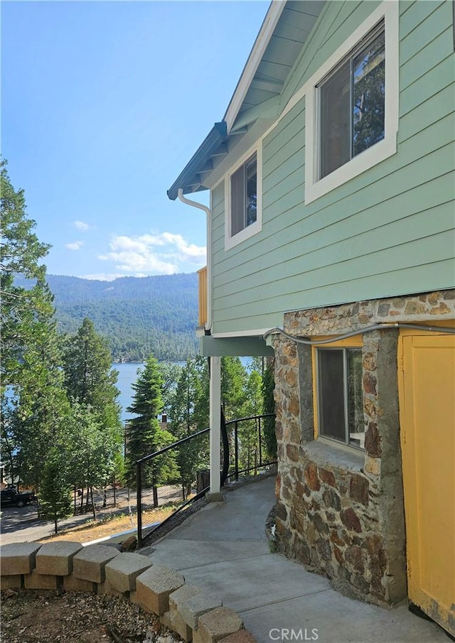 view of home's exterior with a mountain view