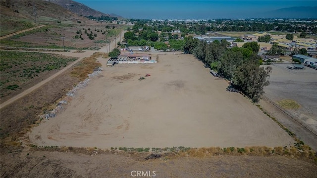 drone / aerial view featuring a rural view and a mountain view