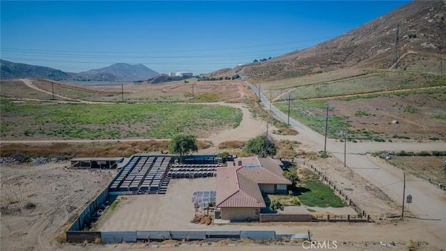 birds eye view of property featuring a mountain view