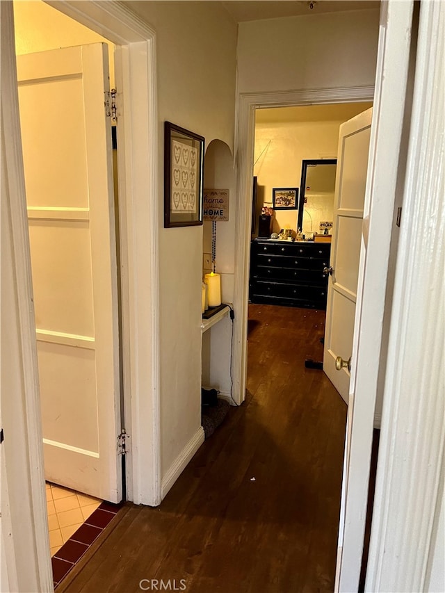 corridor featuring hardwood / wood-style flooring