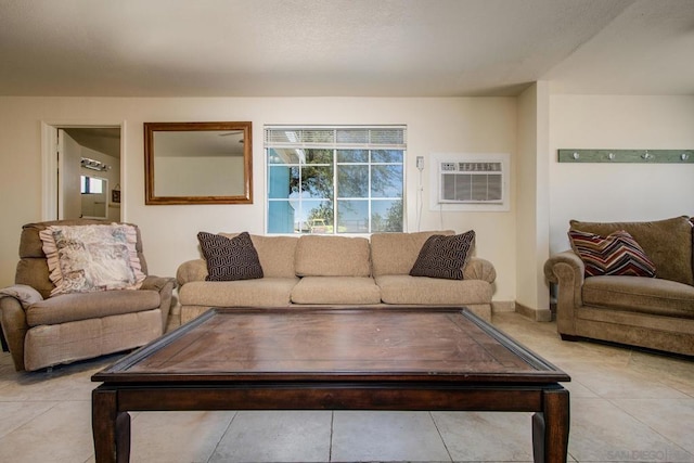 tiled living room featuring a wall mounted air conditioner