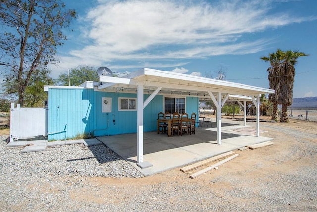 rear view of property featuring a patio area