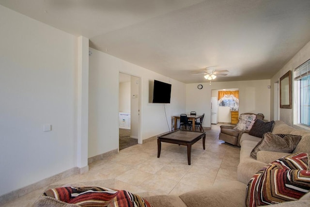 tiled living room featuring ceiling fan