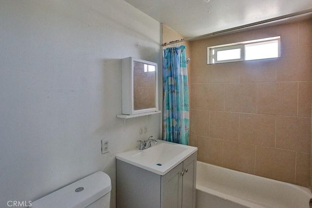 full bathroom featuring vanity, toilet, and shower / bath combo