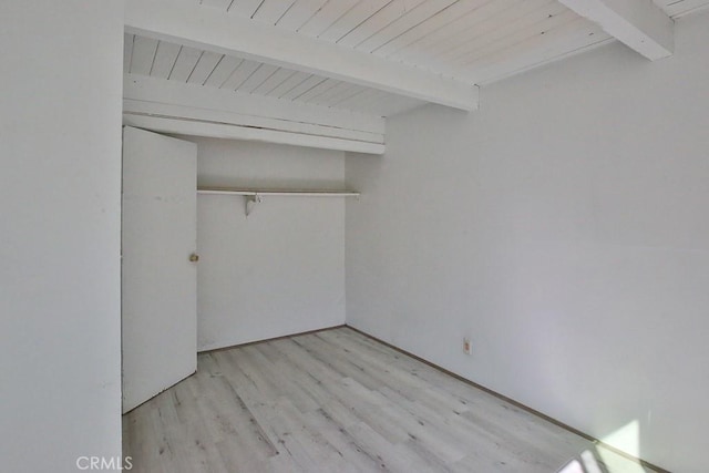 interior space with beamed ceiling and light wood-type flooring