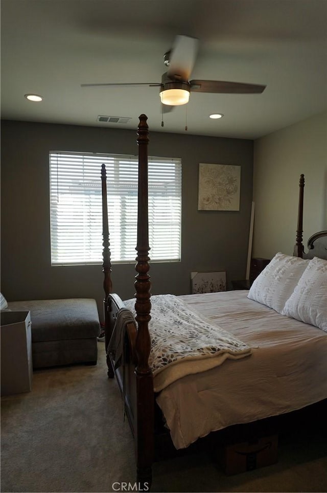 bedroom with ceiling fan and carpet floors