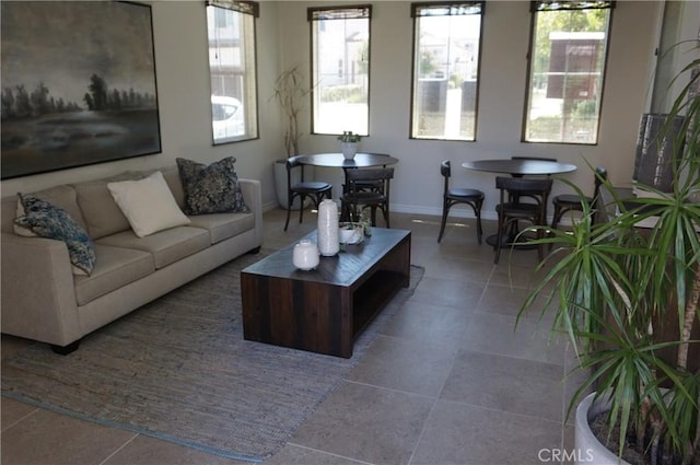 tiled living room with a wealth of natural light