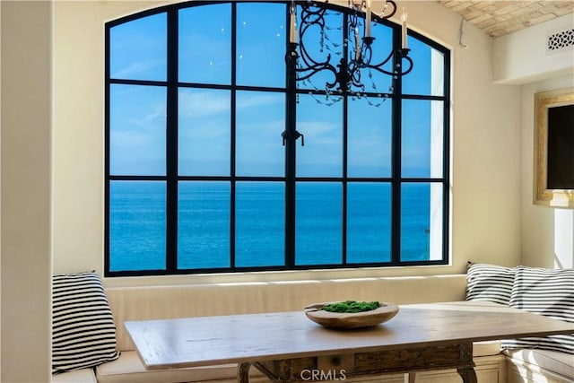 interior space featuring breakfast area and a chandelier