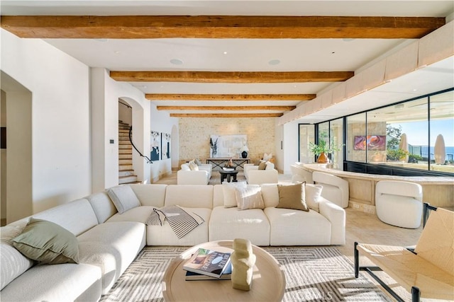 living room featuring beam ceiling