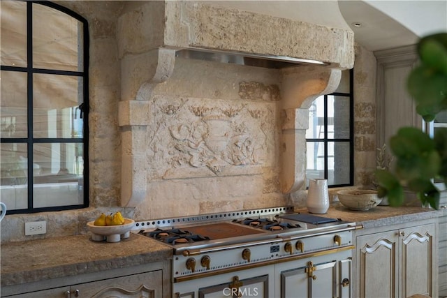 kitchen with stainless steel gas cooktop and tasteful backsplash