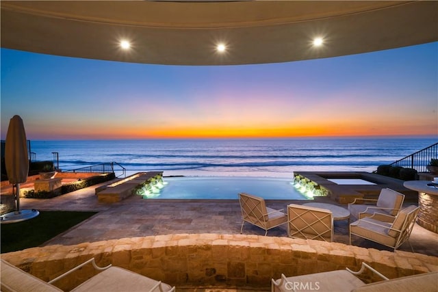 patio terrace at dusk with a water view