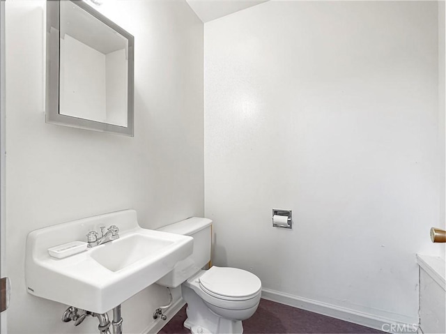 bathroom featuring sink and toilet