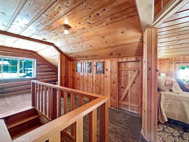 hall with hardwood / wood-style flooring, vaulted ceiling, and wooden ceiling