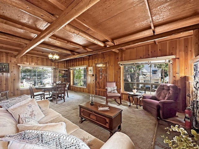 living room with an inviting chandelier, beamed ceiling, wood walls, light colored carpet, and wood ceiling