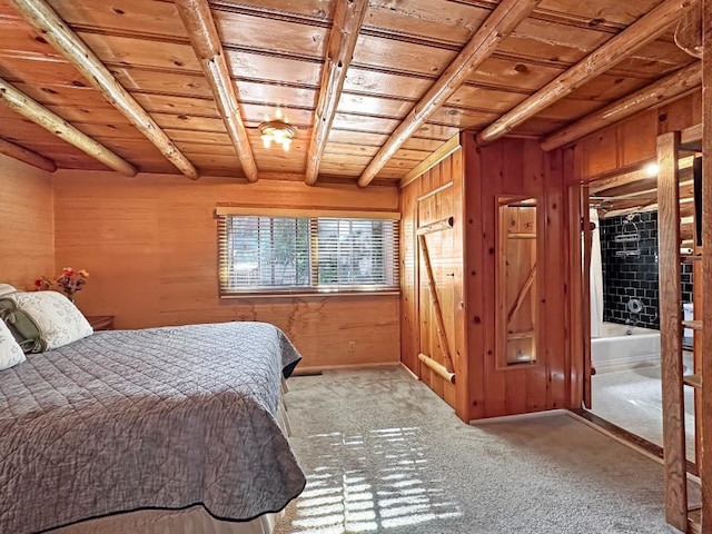 carpeted bedroom featuring beam ceiling, wooden ceiling, wooden walls, and ensuite bathroom