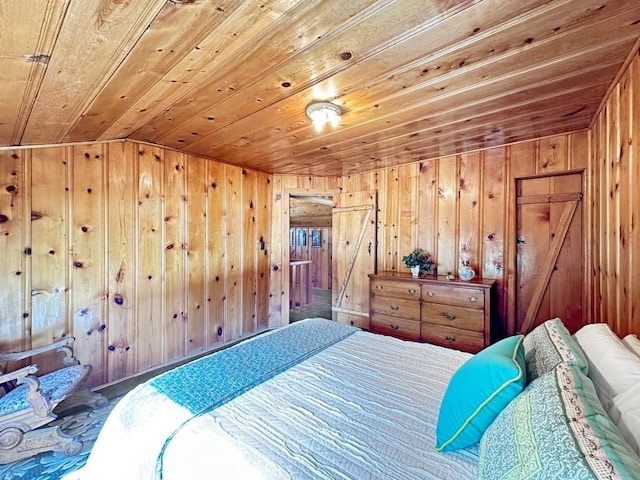 bedroom with vaulted ceiling, wood walls, and wood ceiling