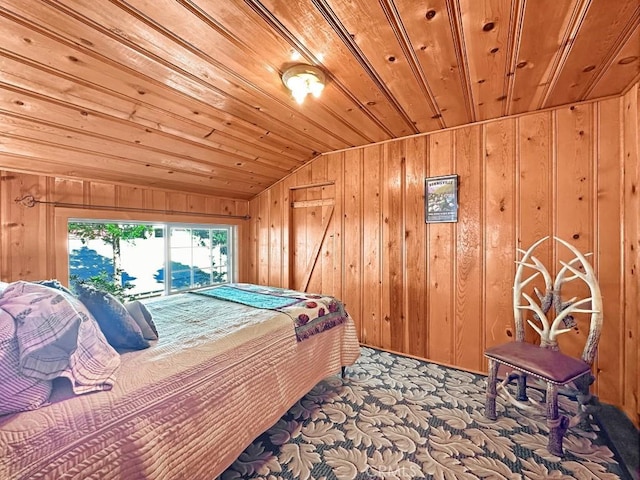 carpeted bedroom with wooden walls, wooden ceiling, and vaulted ceiling